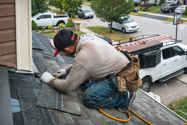Professional Roofing technician working in Burlington, VT